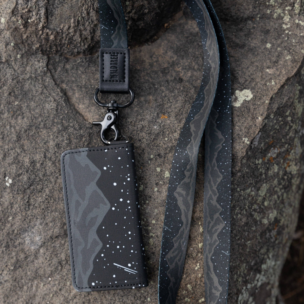 Forager Provisions LTD Wildtree Midnight Mountain card holder with matching lanyard on a rocky surface
