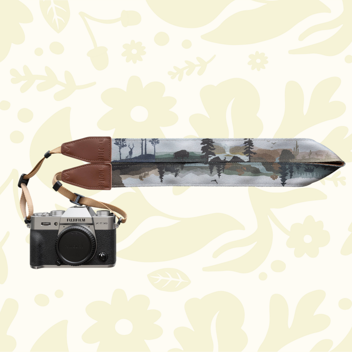 Forager Provisions LTD Wildtree Wildlife Wander camera strap with wilderness landscape print and brown leather ends.