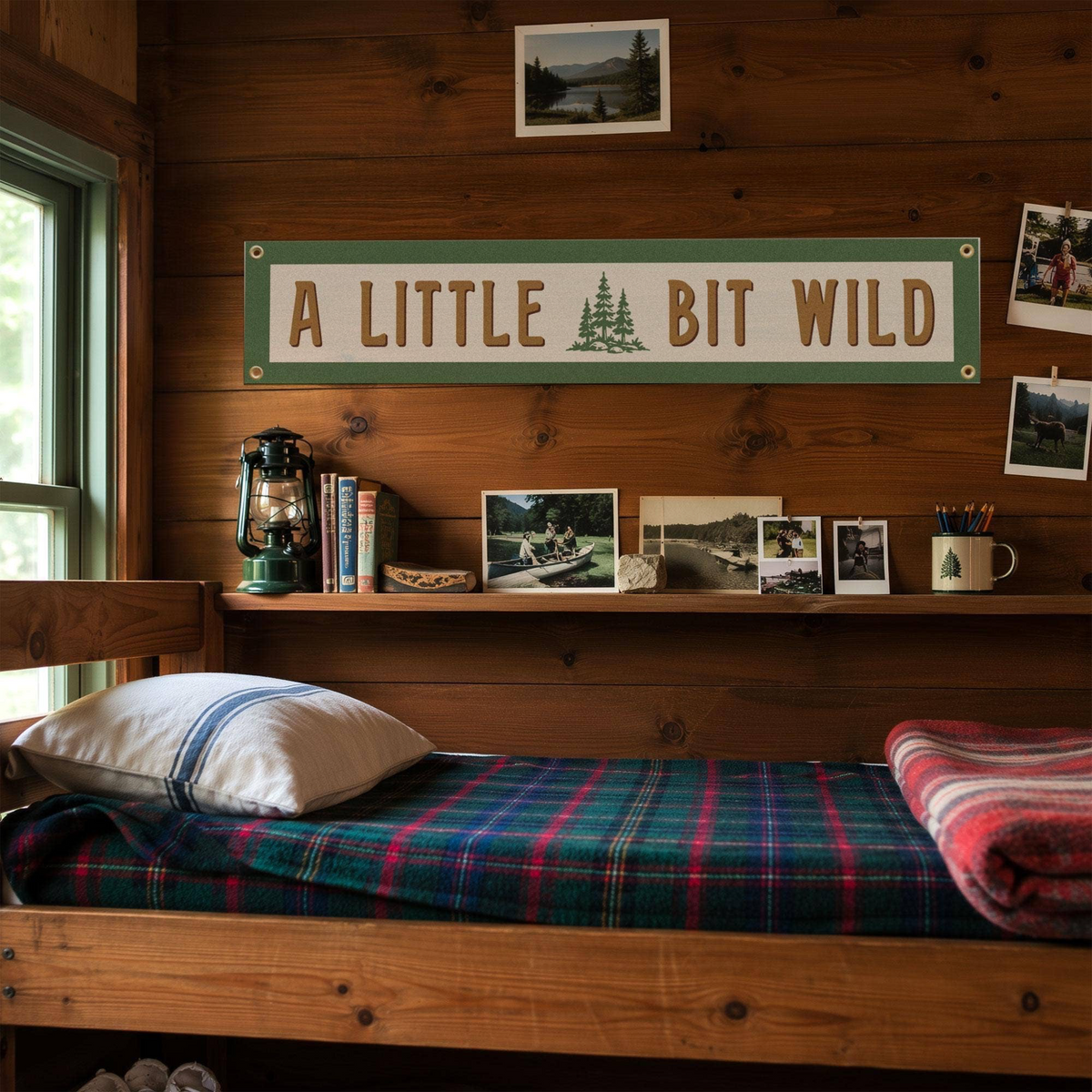 Forager Provisions LTD Benoit's Design Co. A Little Bit Wild felt wall banner hanging in a rustic wooden cabin room.
