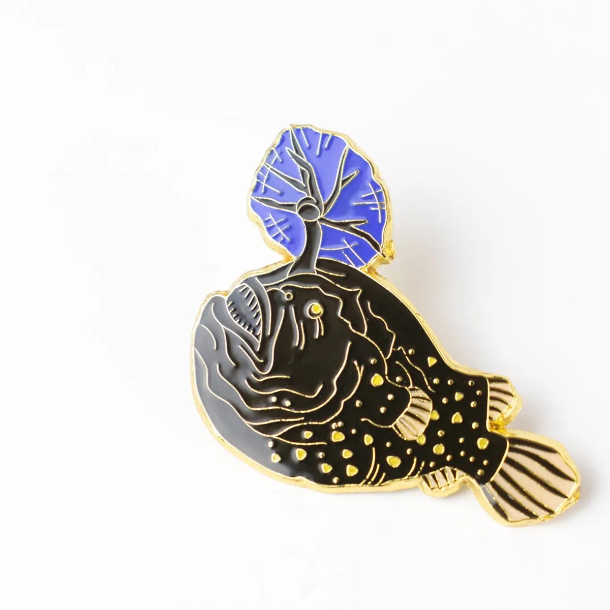 Forager Provisions LTD Stemcell Science Atlantic Football Fish enamel pin with a black body and blue glowing lure.