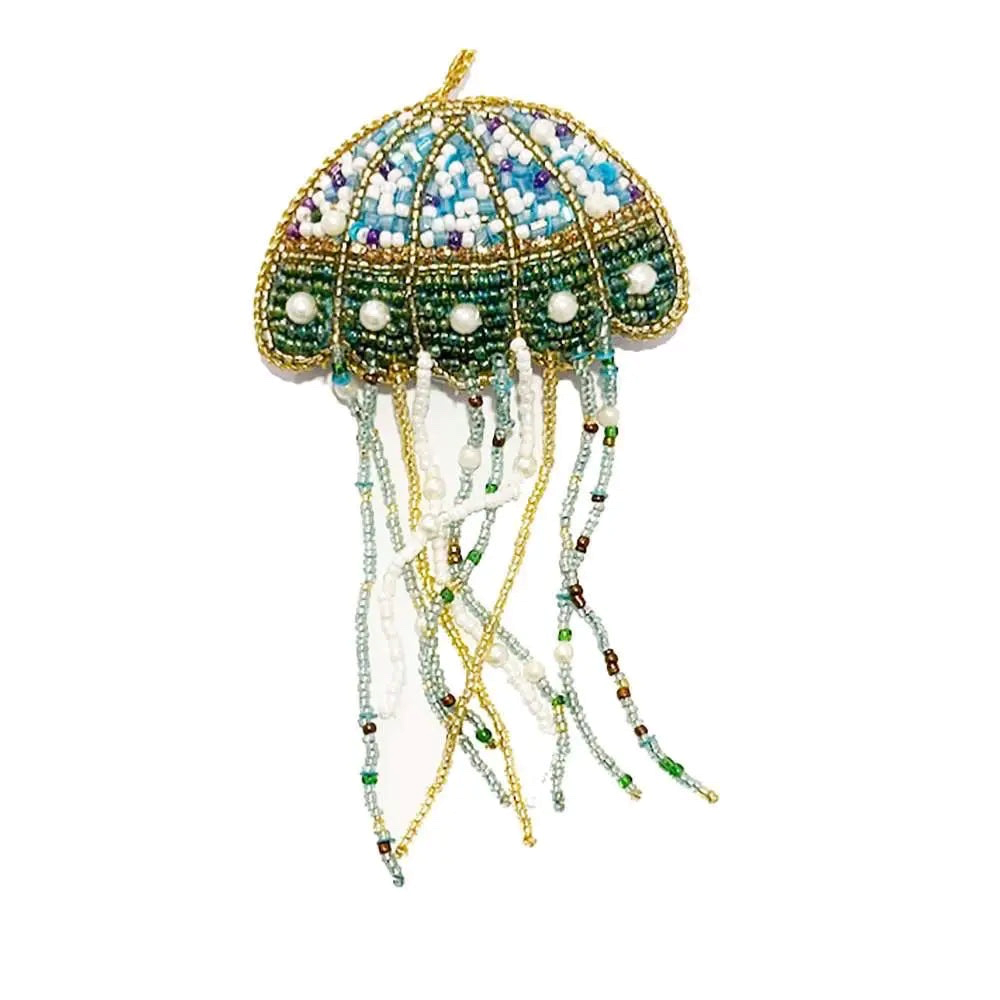 Forager Provisions LTD hanging beaded jellyfish Christmas ornament in blue, green, and gold with dangling tentacles.
