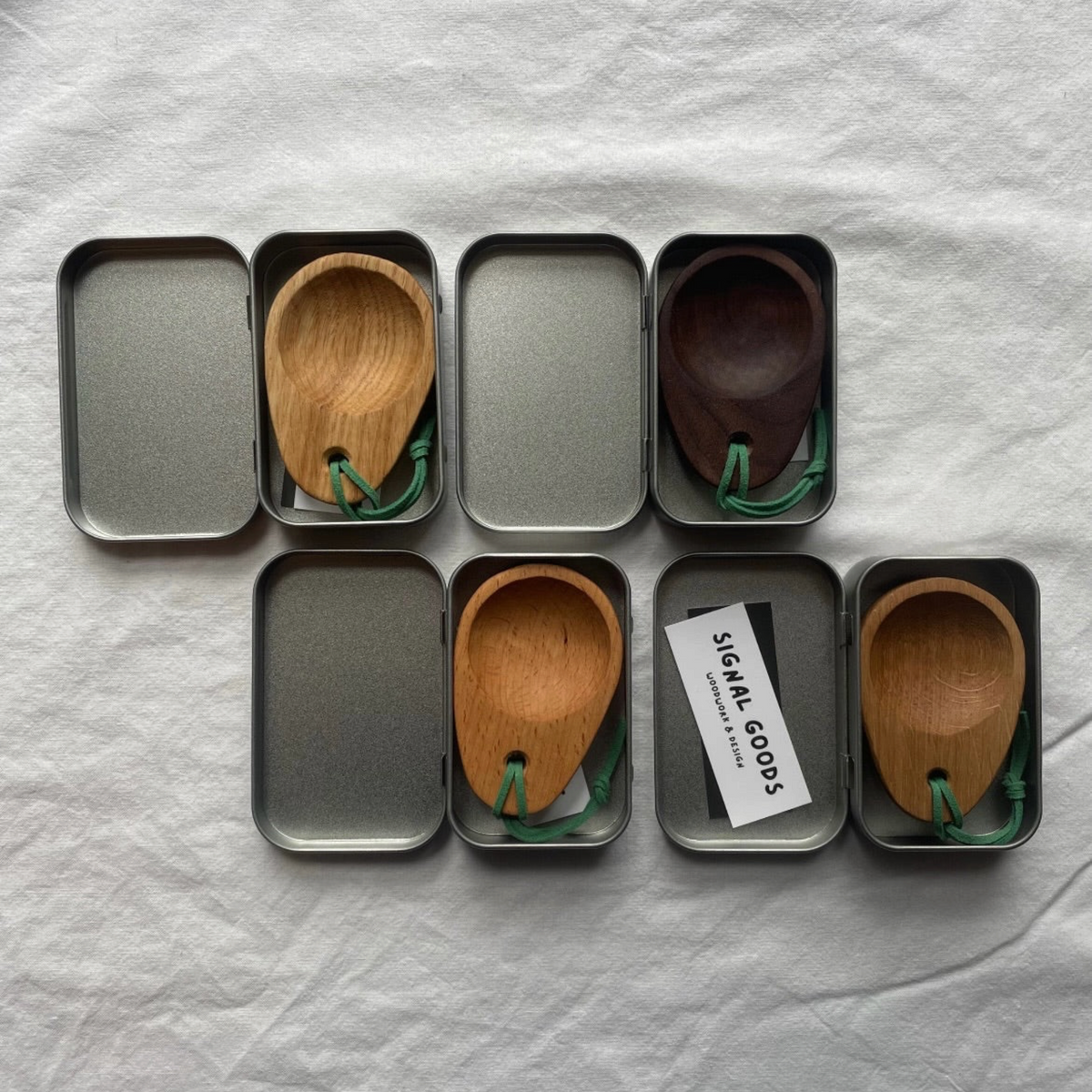 Forager Provisions LTD beech wood camping scoops by Signal Goods in individual metal gift tins with green ties.