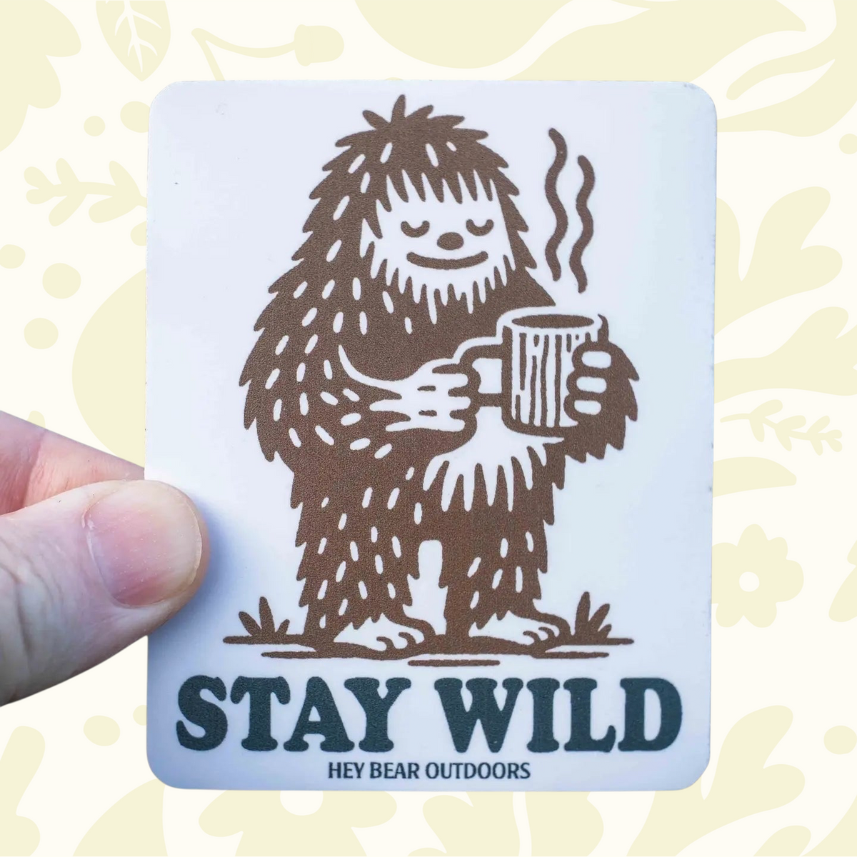 Forager Provisions LTD Hey Bear Outdoors sticker featuring a brown Bigfoot character holding a steaming coffee mug.
