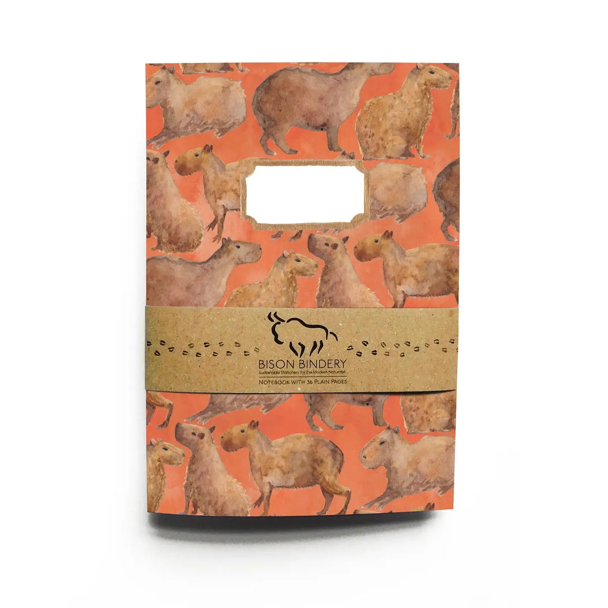 Forager Provisions LTD Bison Bindery A5 recycled notepad with an orange capybara pattern and a paper belly band.