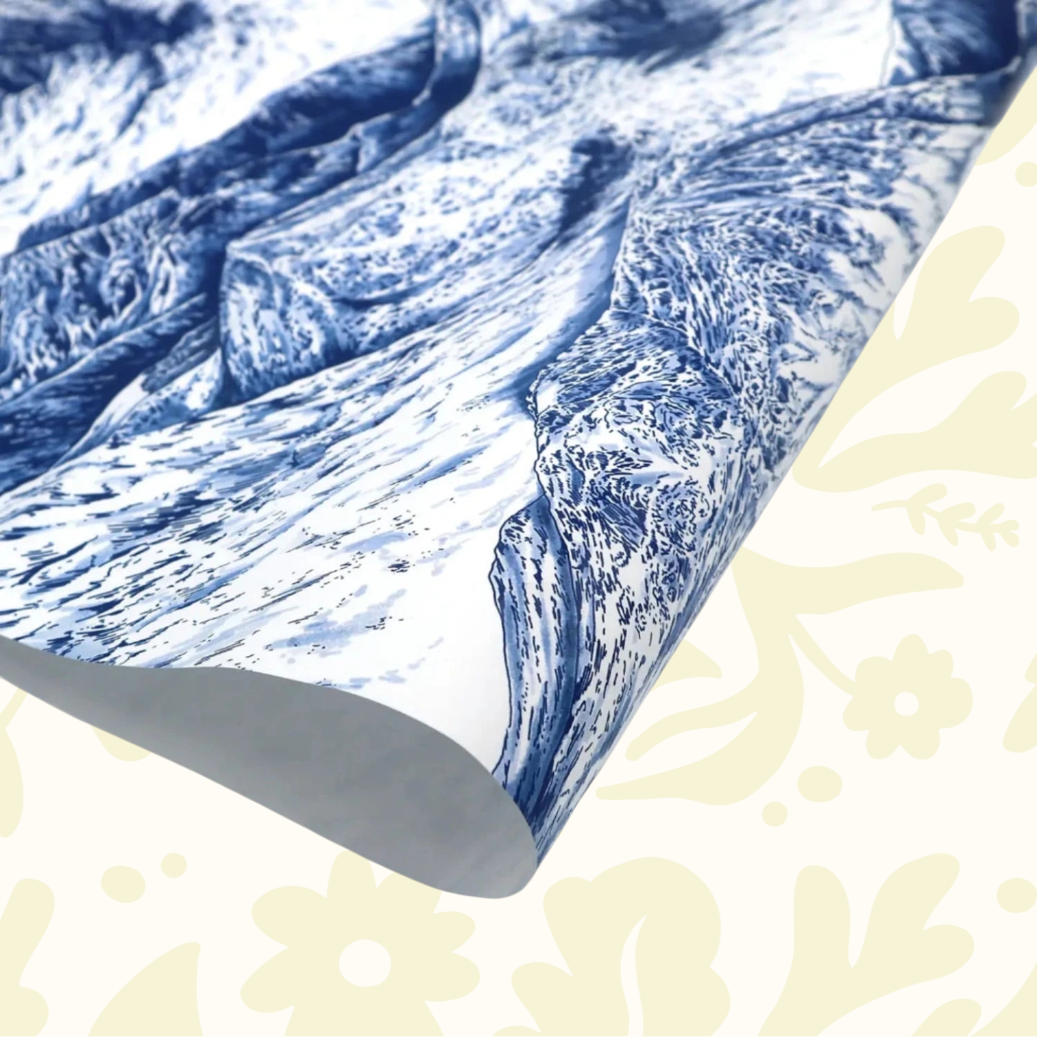 Forager Provisions LTD gift wrapping paper featuring a detailed blue and white mountain landscape illustration