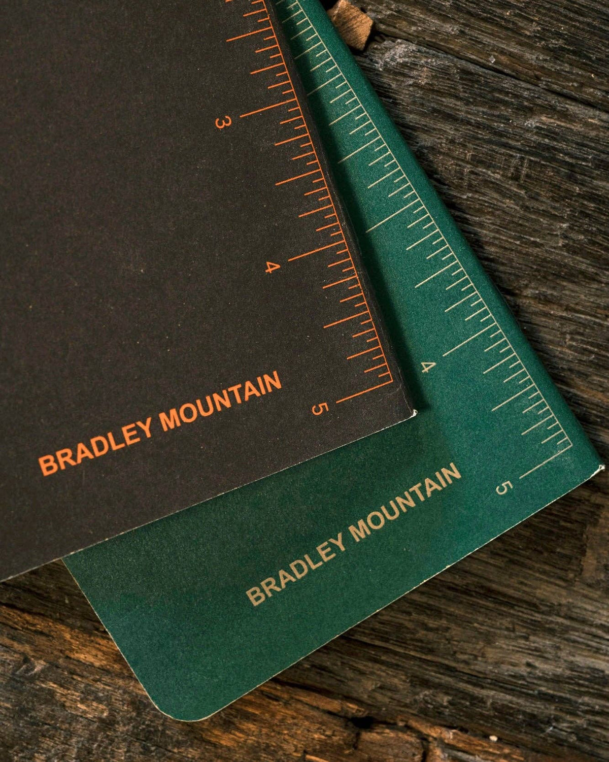 Forager Provisions LTD Bradley Mountain pocket journals with dark green and black covers featuring dot grid rulers.