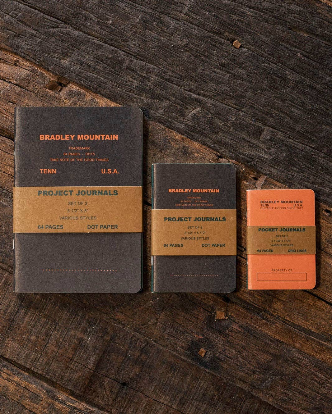 Forager Provisions LTD Bradley Mountain pocket journals in various sizes and colours with dot grid pages on wood table