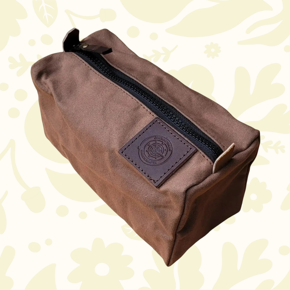 Forager Provisions LTD Journeyman Craft brown waxed canvas camping peg case with a rugged YKK zipper and leather logo.