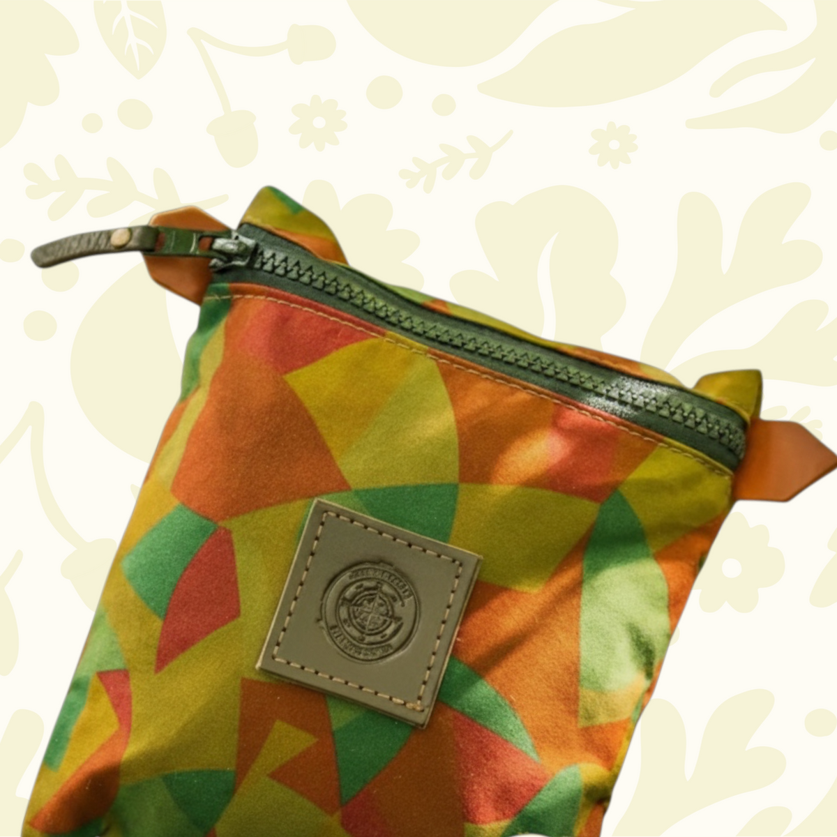 Forager Provisions LTD Journeyman Craft camo zipper pouch made from reclaimed fabric with a leather logo patch