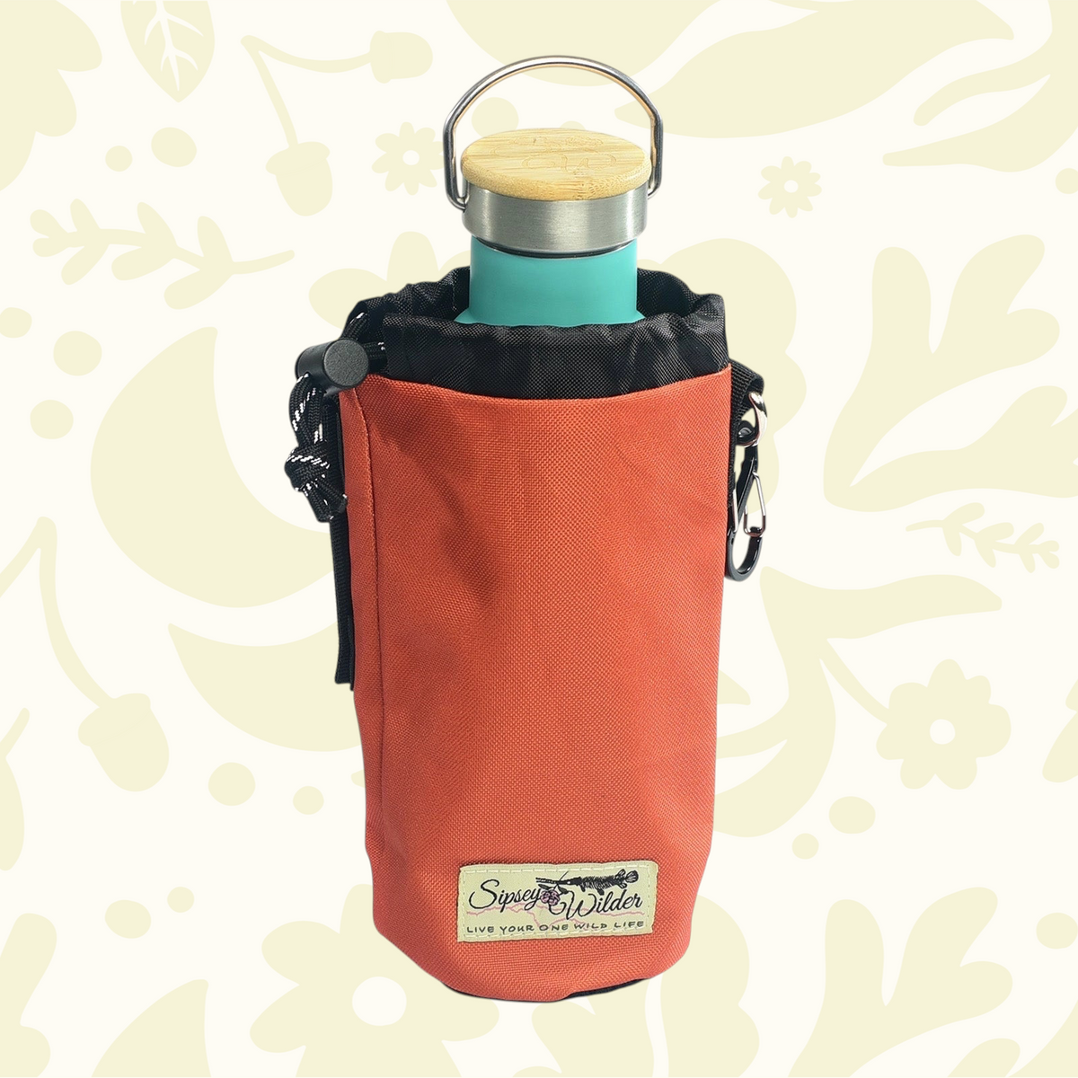 Forager Provisions LTD Sipsey Wilder campfire orange water bottle holder with a teal bottle inside.