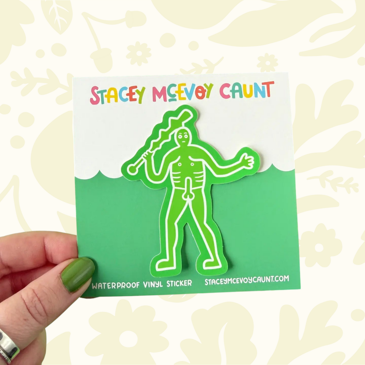 Forager Provisions LTD Cerne Giant vinyl sticker by Stacey McEvoy Caunt featuring a green folk art figure on a card.