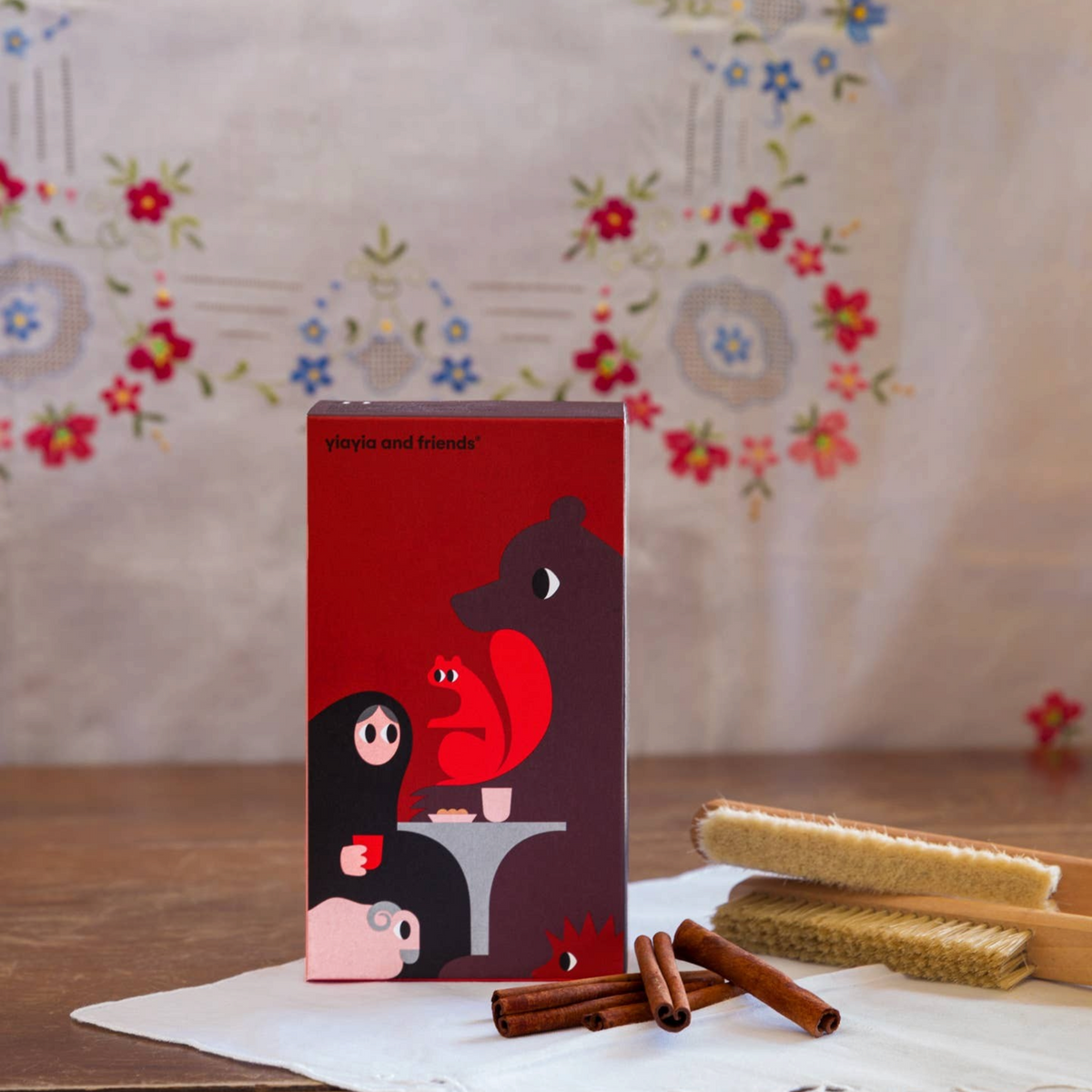 Forager Provisions LTD cinnamon biscuits from Crete in a red illustrated box with cinnamon sticks on a white cloth
