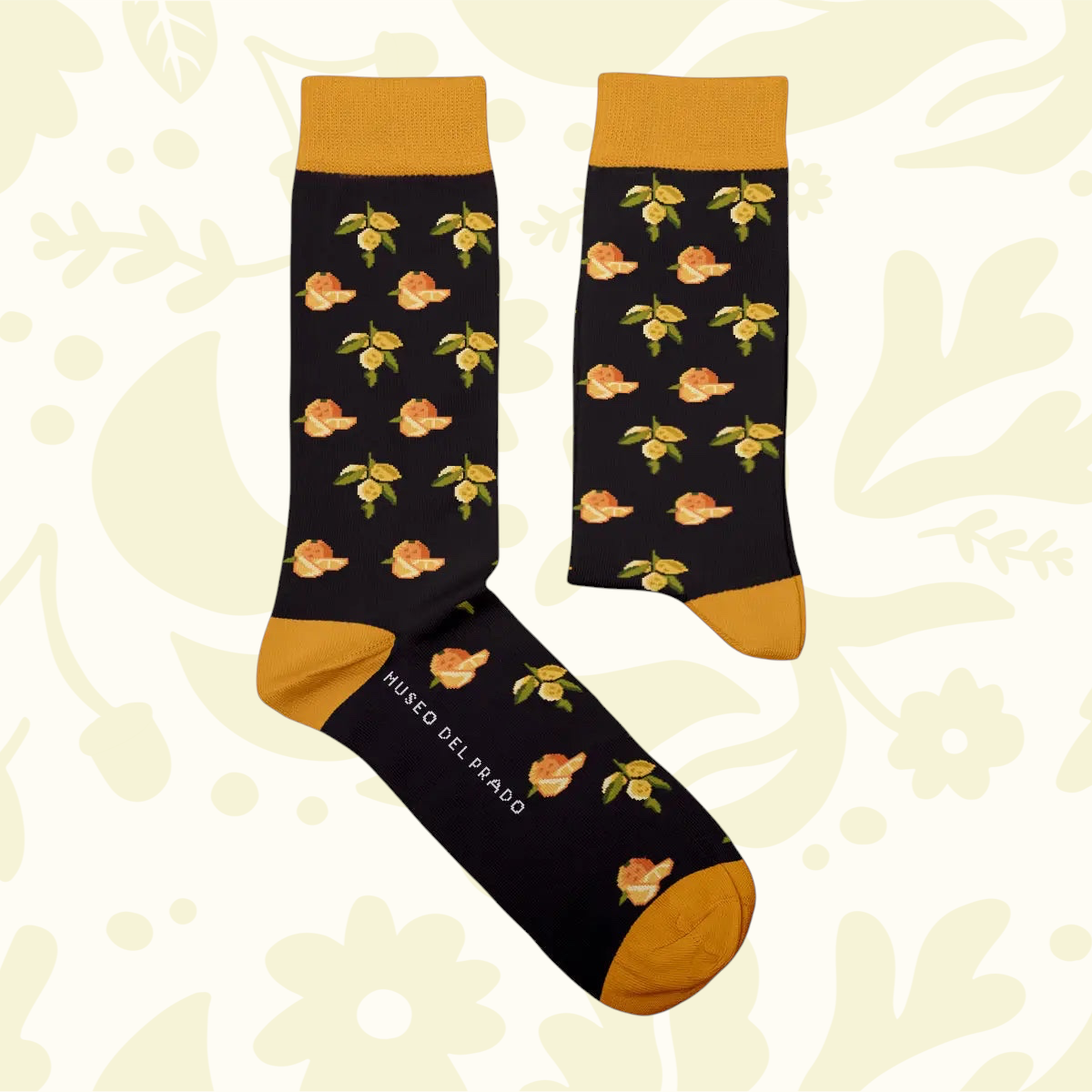 Forager Provisions LTD cotton blend socks featuring a black base with orange and lemon fruit motifs and mustard accents.