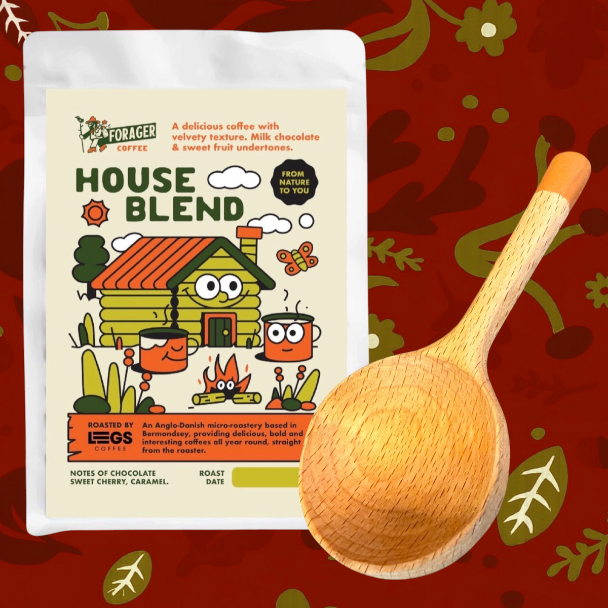 Forager Provisions LTD coffee gift set featuring House Blend coffee and a handmade wooden scoop with orange paint.
