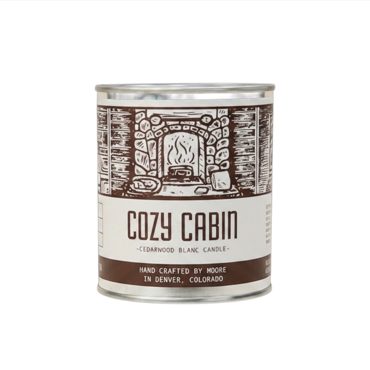 Forager Provisions LTD Moore Collection Cozy Cabin soy wax candle in a rustic metal tin with woodsy scent notes