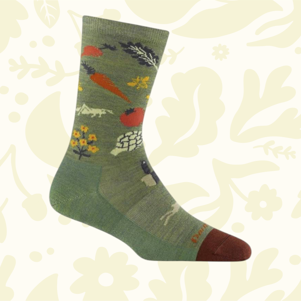 Forager Provisions LTD Darn Tough lightweight merino wool crew socks in olive green with a whimsical vegetable pattern.