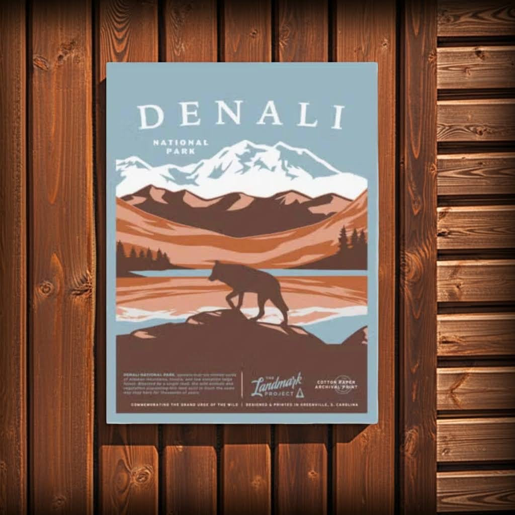 Forager Provisions LTD Denali National Park poster featuring a wolf silhouette against a mountain landscape on wood wall.