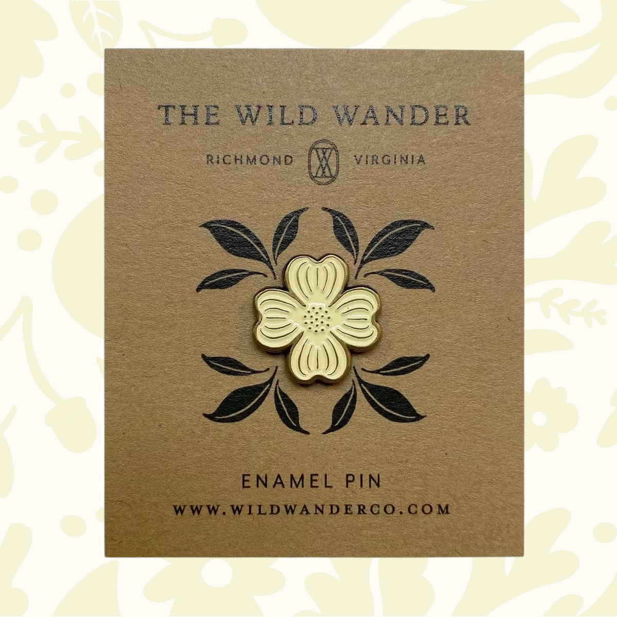 Forager Provisions LTD ivory dogwood flower enamel pin with antique gold accents on a kraft backing card.