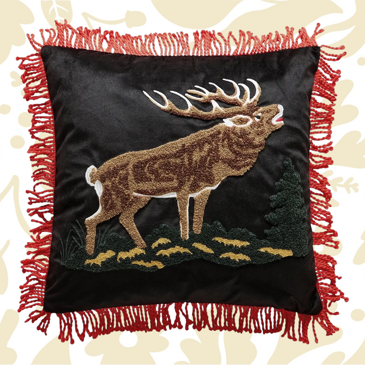Forager Provisions LTD needle punch elk pillow on black fabric with red tassel trim and lodge-inspired design.