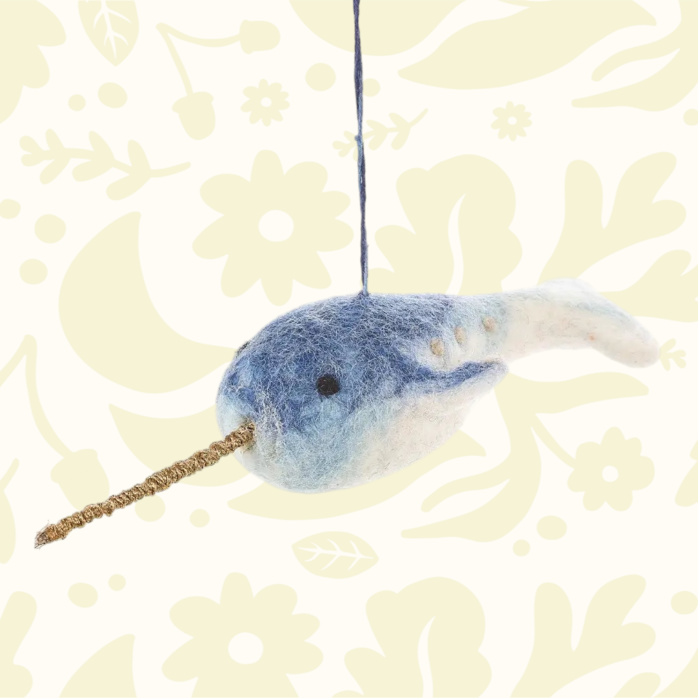 Forager Provisions LTD handmade blue and white wool felt narwhal ornament with a gold tusk hanging on a string