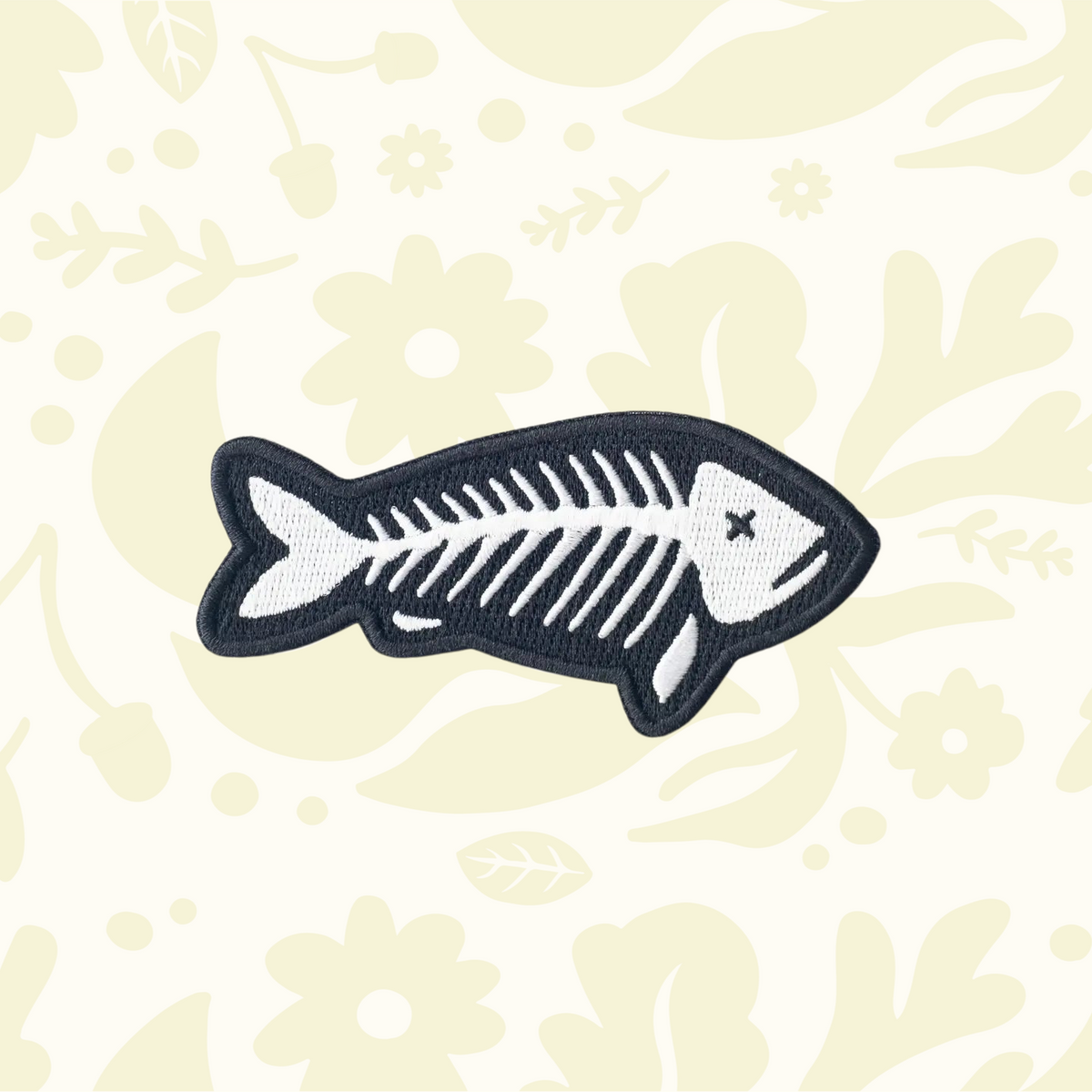 Forager Provisions LTD fish skeleton embroidered patch in black and white, suitable for iron-on or sew-on application.