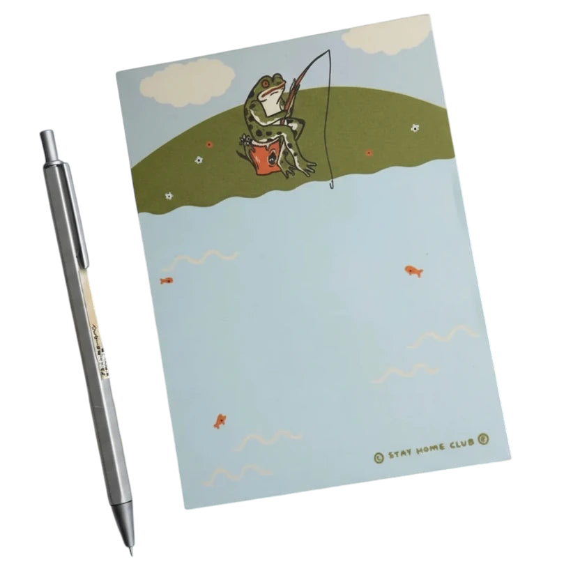 Forager Provisions LTD Stay Home Club notepad featuring a full-colour illustration of a frog fishing on a pond bank.