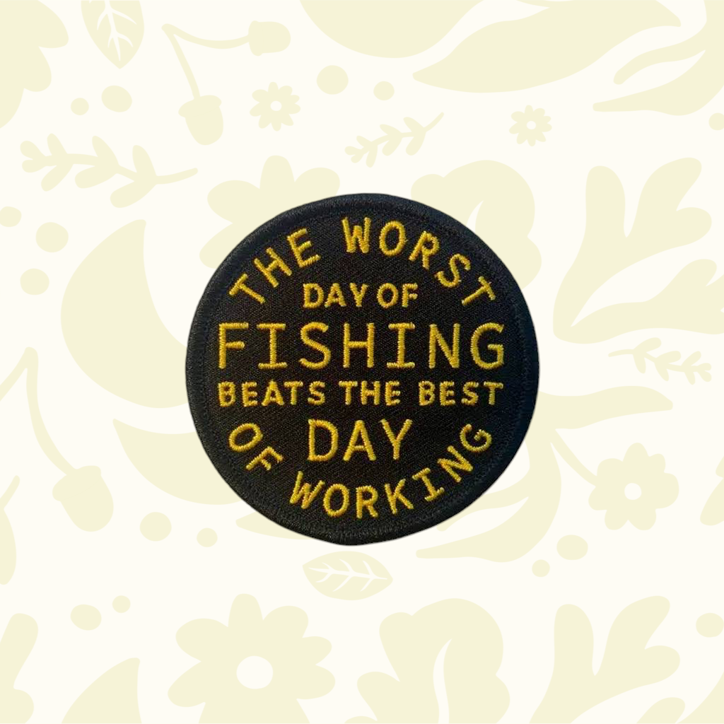 Forager Provisions LTD circular embroidered patch with gold text reading The Worst Day Of Fishing Beats The Best Day Of Working on a black background.