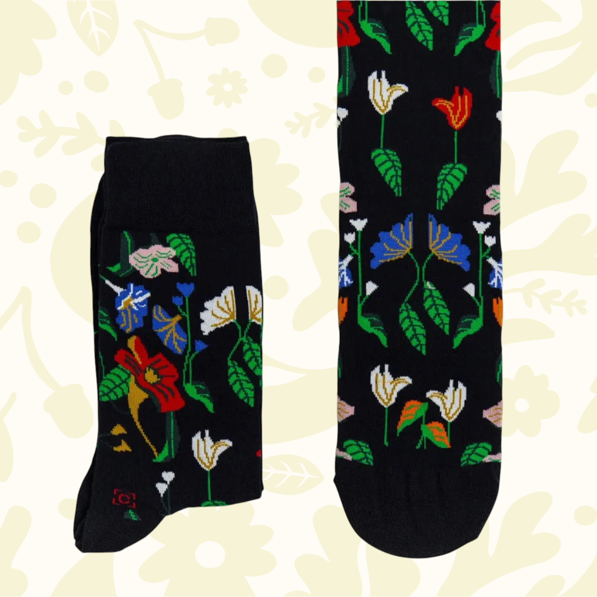 Forager Provisions LTD cotton blend socks featuring a black background with colorful Severin Roesen floral patterns.