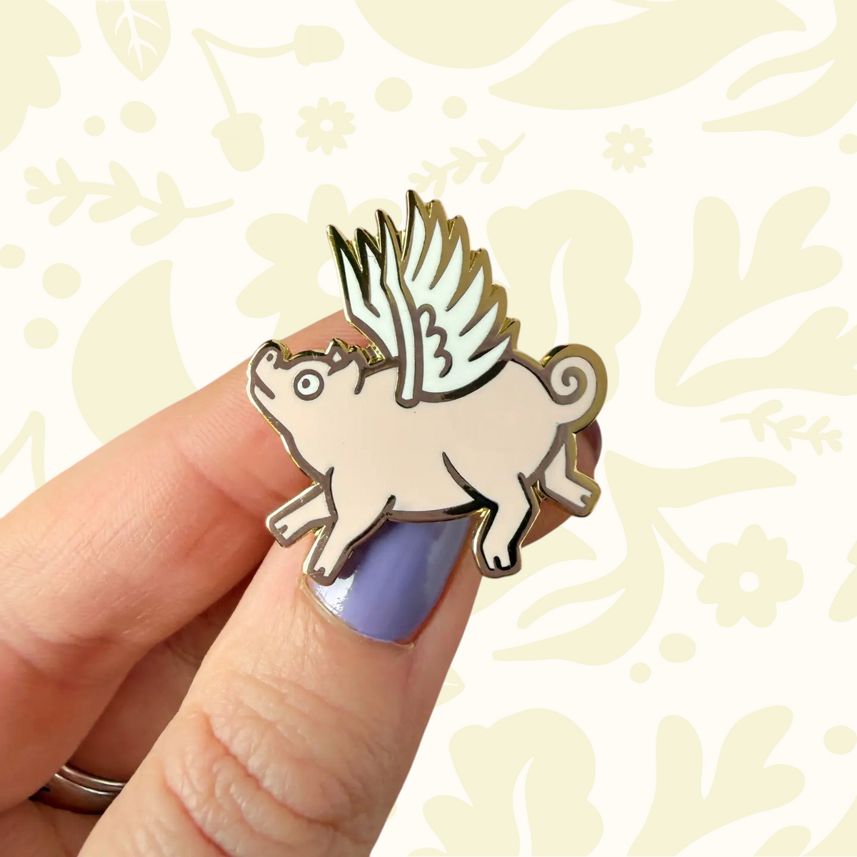 Forager Provisions LTD Stacey McEvoy Caunt enamel pin featuring a whimsical pink flying pig with white wings