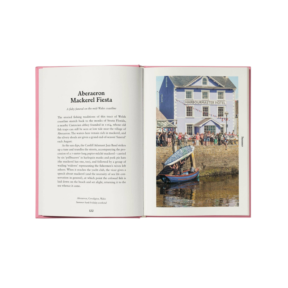 Open hardback book Folk Britain by Forager Provisions LTD showing a page about the Aberaeron Mackerel Fiesta in Wales