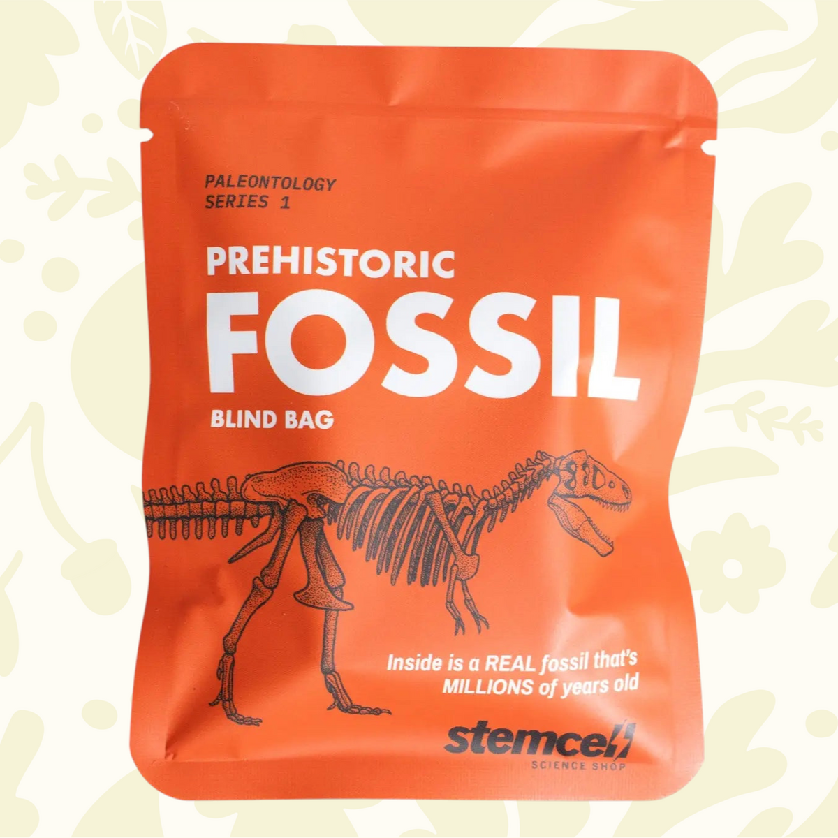 Forager Provisions LTD Stemcell Science orange fossil blind bag featuring a dinosaur skeleton illustration.