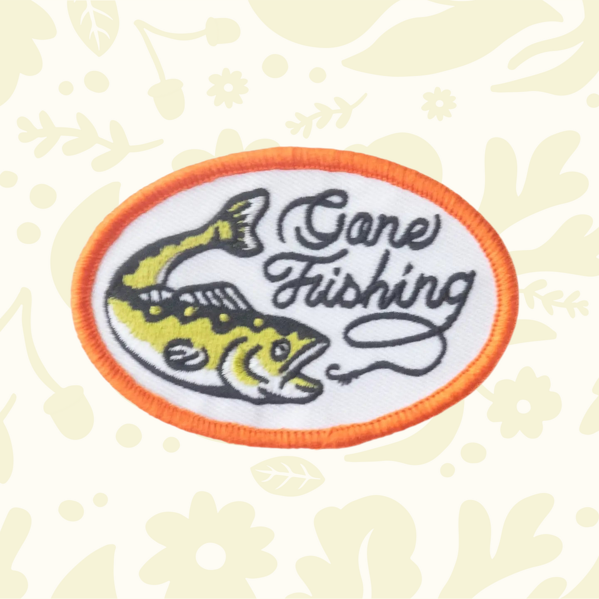 Forager Provisions LTD oval embroidered iron-on patch featuring a yellow fish and Gone Fishing text on white fabric.