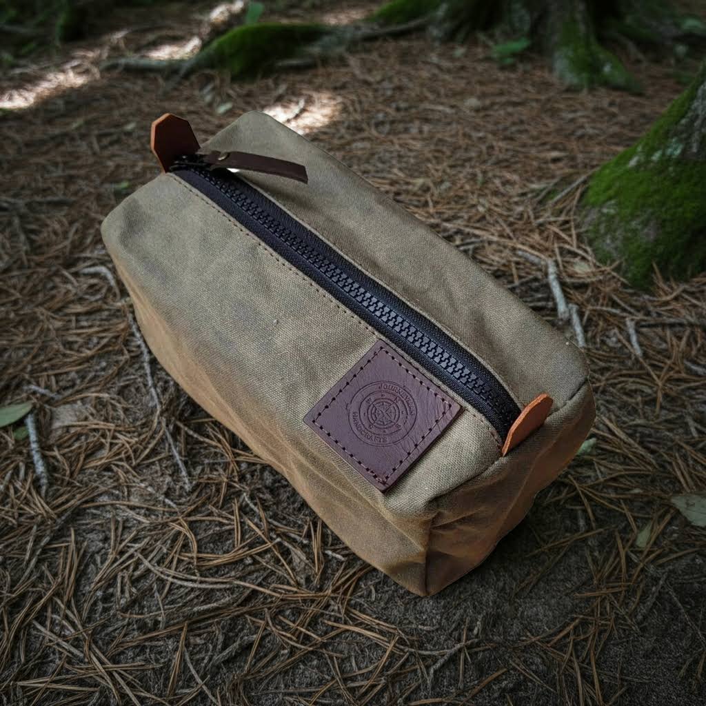 Forager Provisions LTD Journeyman Craft green waxed canvas camping peg case with YKK zipper on a forest floor