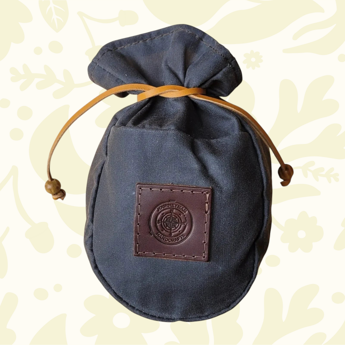 Forager Provisions LTD Journeyman Handcraft grey waxed canvas coffee pouch with a leather drawstring and logo patch.
