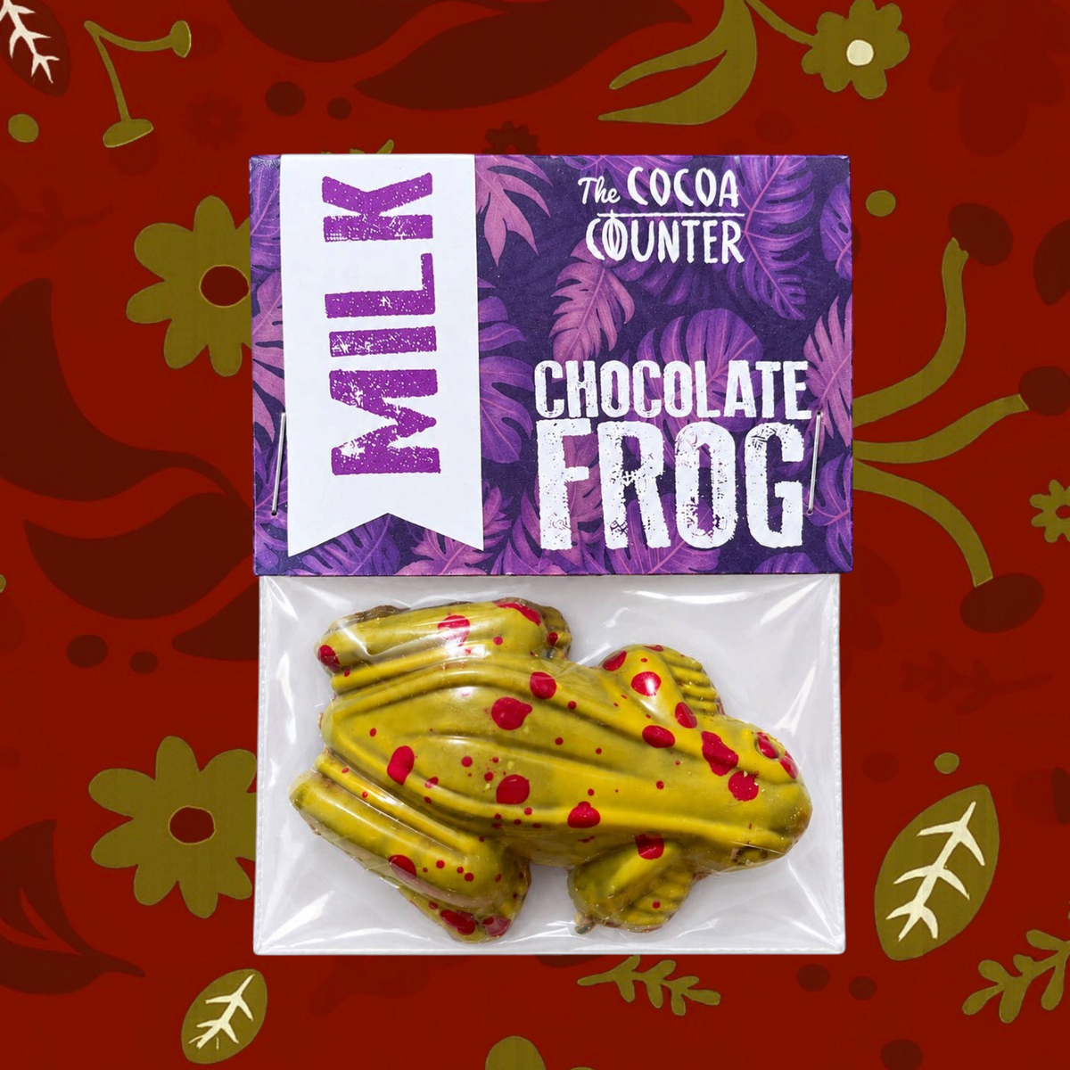 Forager Provisions LTD Cocoa Counter hand-painted milk chocolate frog in yellow and red, packaged in a bio bag.