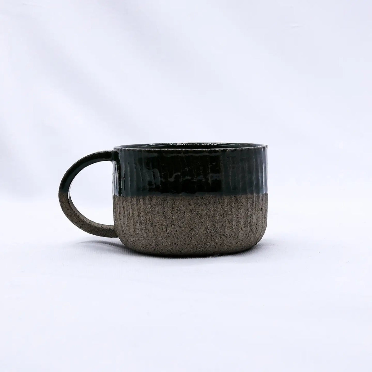 Forager Provisions LTD Ribera Bluverde Arte handmade smoked grey stoneware mug with a textured, two-tone finish.