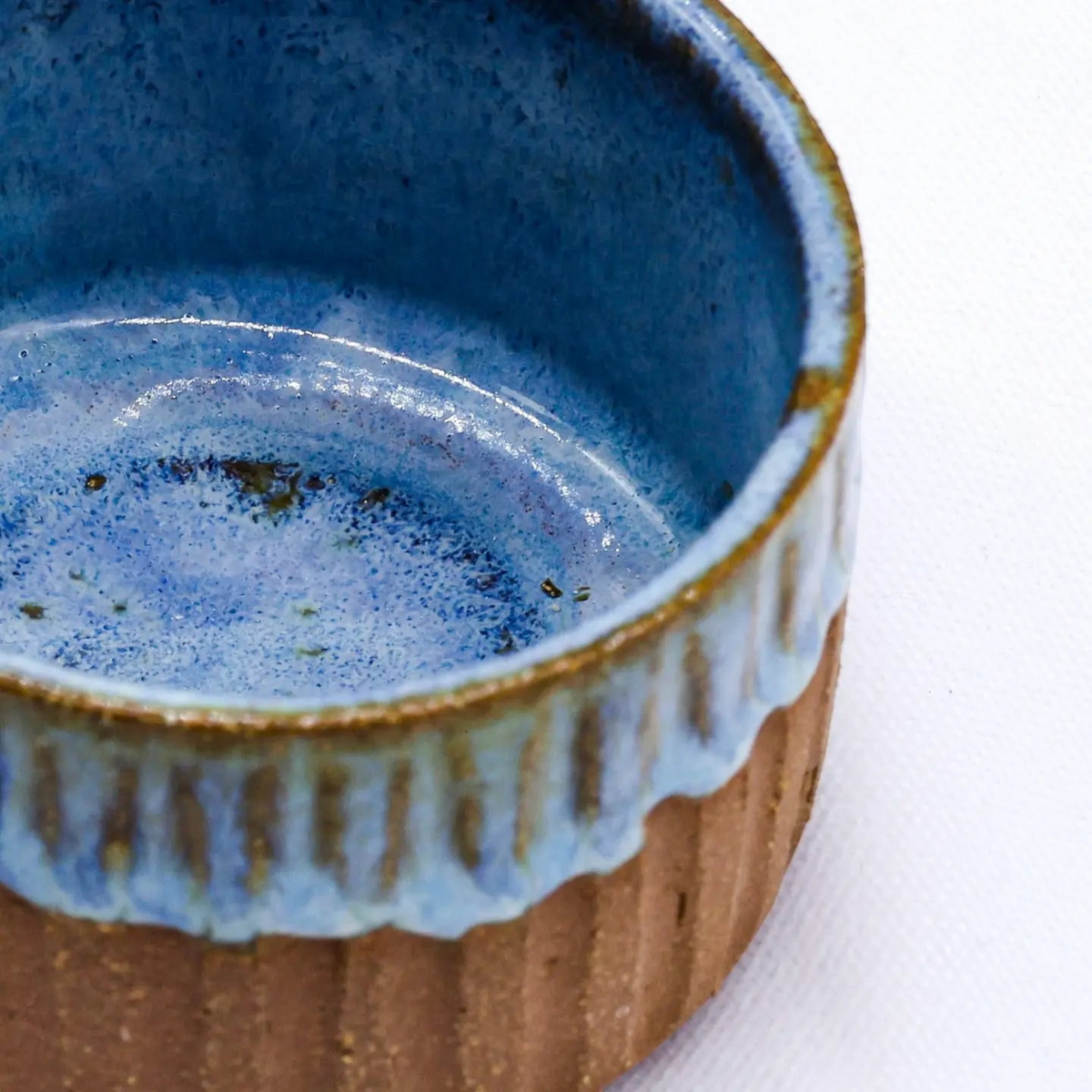 Forager Provisions LTD Ribera Bluvio Arte handmade stoneware mug with a blue glazed interior and ribbed brown exterior.