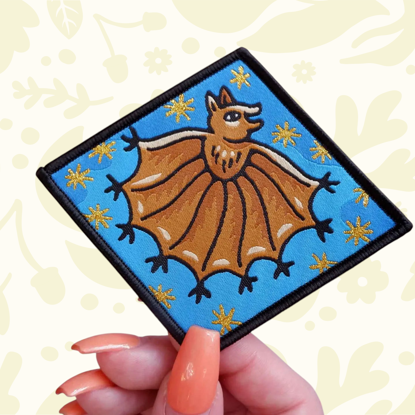 Forager Provisions LTD Cat Coven Handsy Bat iron-on embroidered patch featuring a brown bat on a bright blue background.