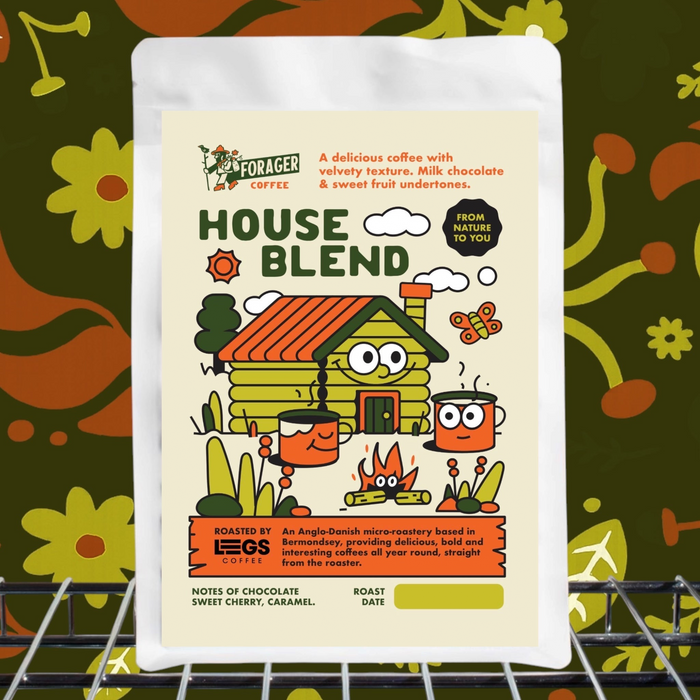 Forager Provisions 250g House Blend coffee beans on metal shelf, floral background, rustic cabin label, specialty coffee.