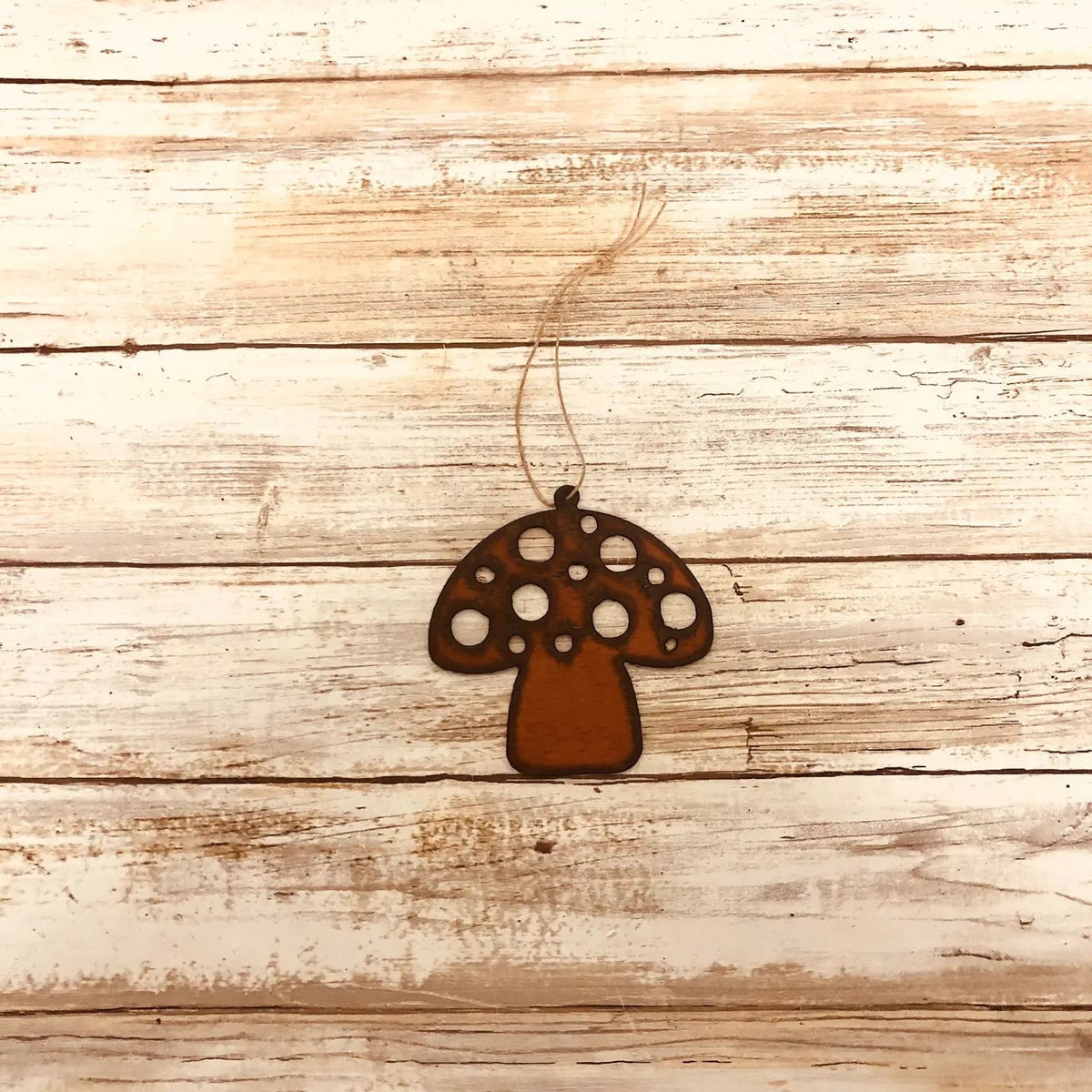 Forager Provisions LTD iron redcap mushroom hanging decoration with rustic finish on a wooden background