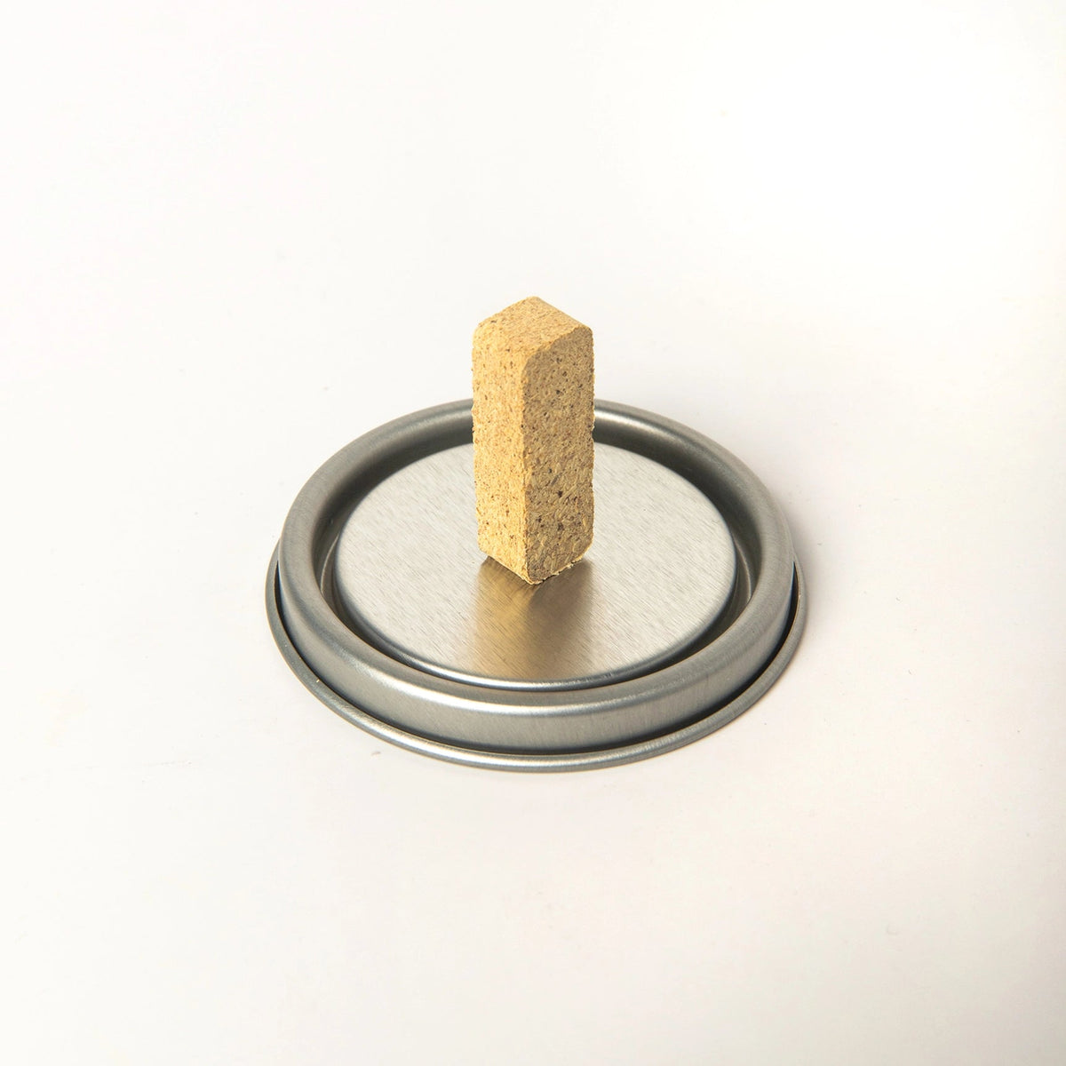 American Heritage Brands Juniper 20 Incense Bricks box upright on metal lid, perfect for aromatherapy, against white background.