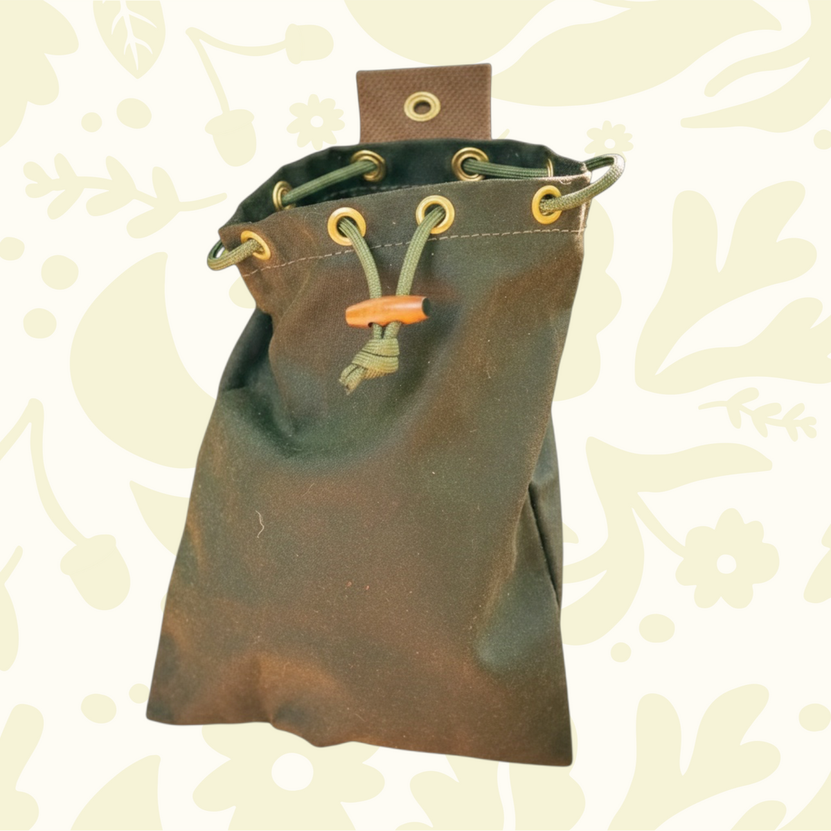Forager Provisions LTD Journeyman Handcraft khaki green waxed canvas forager's pouch with a drawstring closure.
