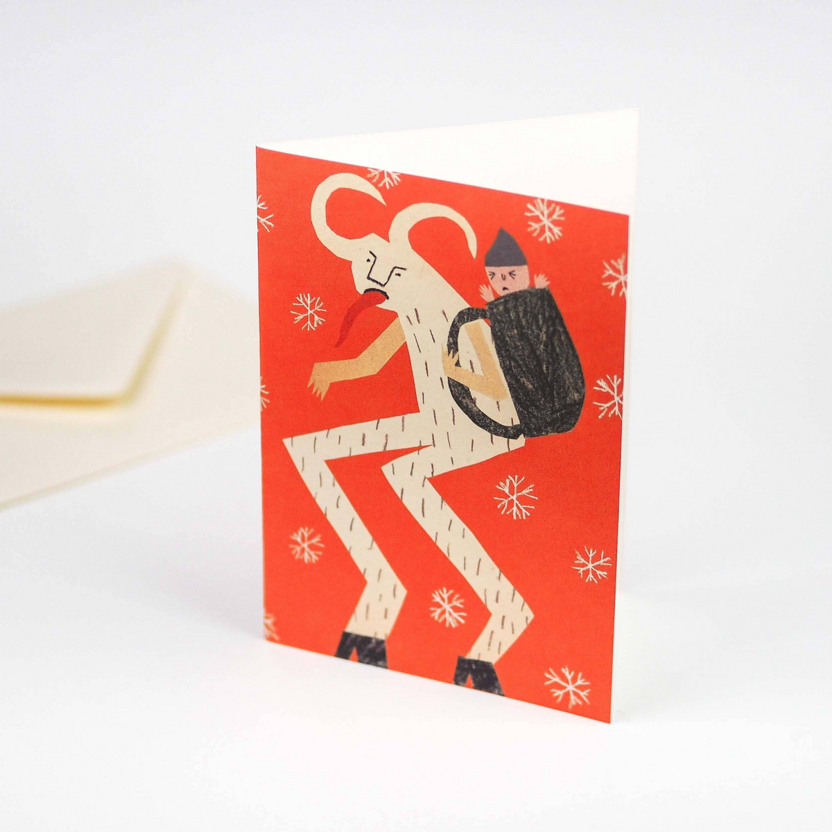 Forager Provisions LTD Krampus Christmas card featuring a red background with a horned creature carrying a child