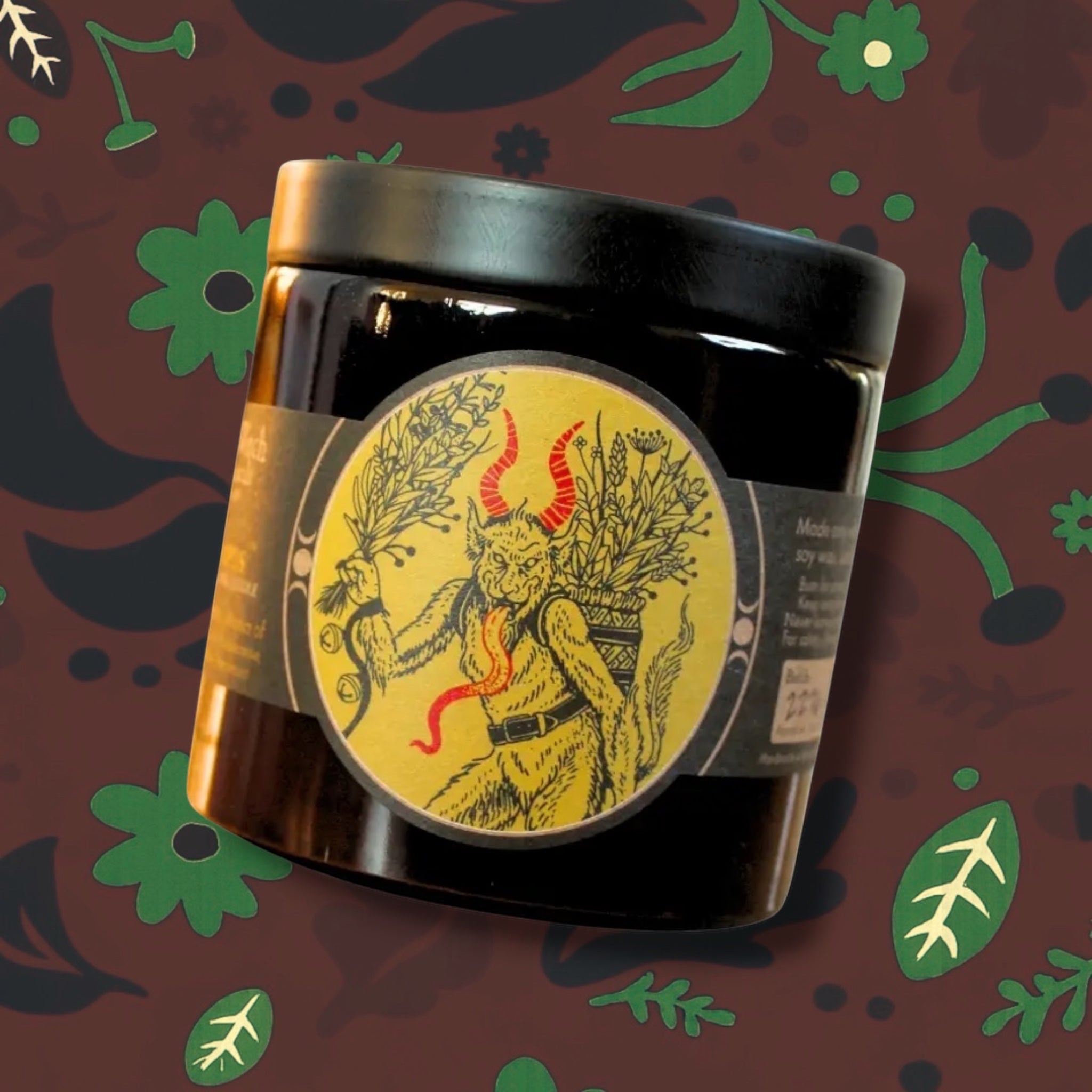 Forager Provisions LTD Sea Witch Botanicals Krampus soy wax candle in a black glass jar with a folklore-inspired label.