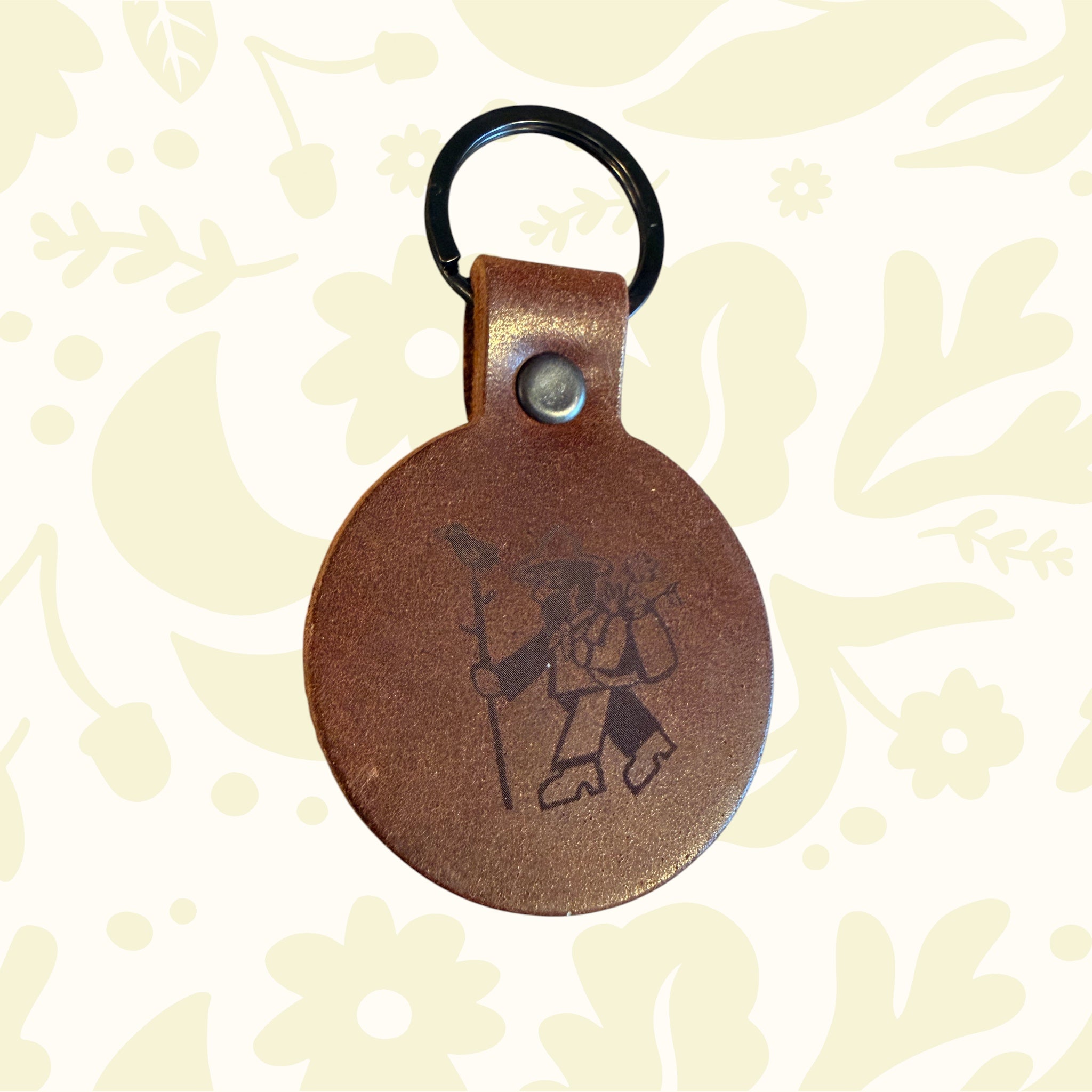 Forager Provisions LTD circular English Bridle leather keyring with a black D-ring and branded logo detail.