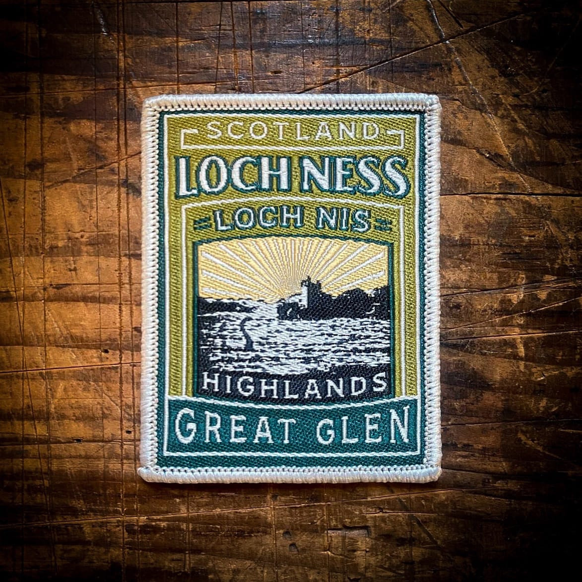 Forager Provisions LTD embroidered Loch Ness patch featuring a Scottish Highland landscape and Nessie silhouette.