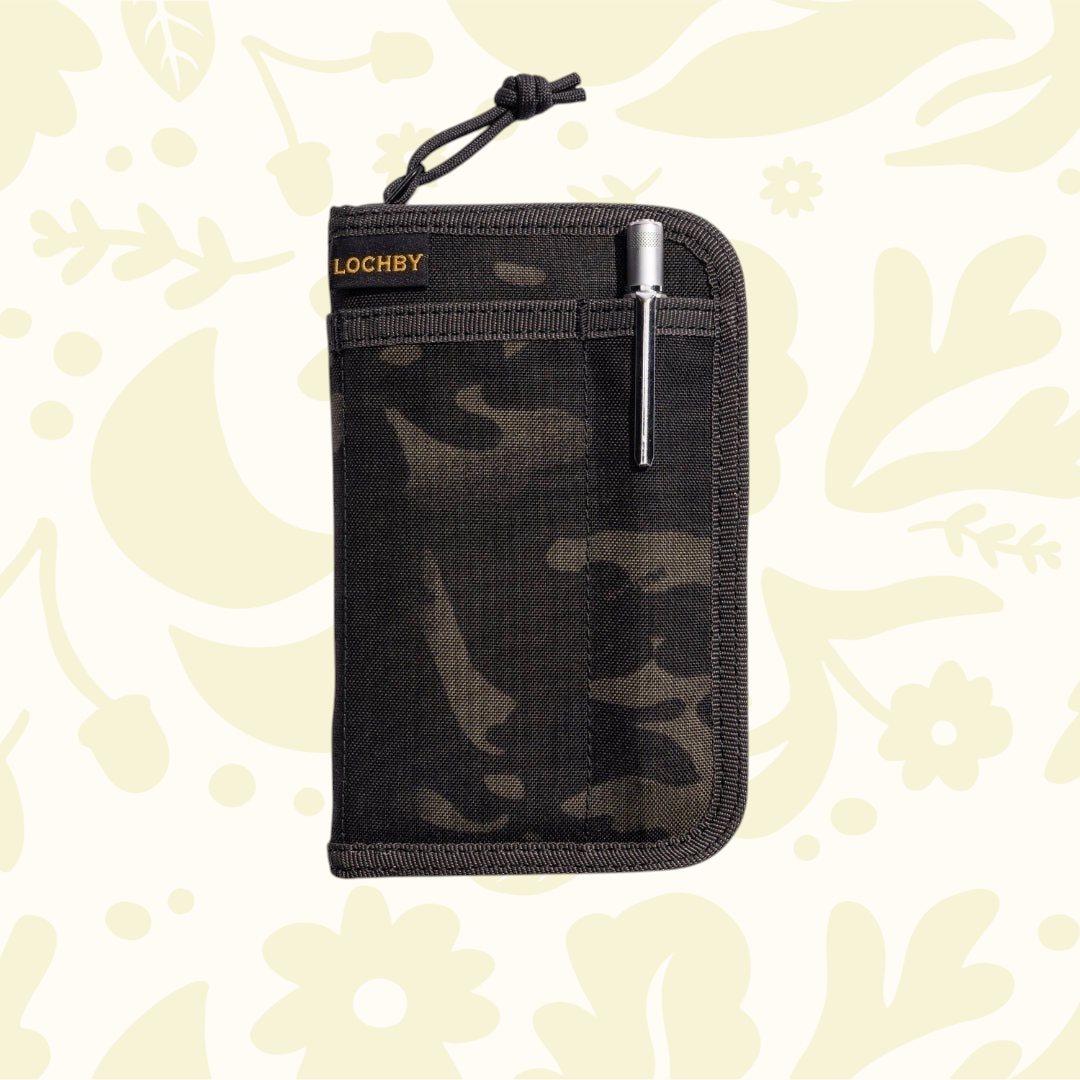 Forager Provisions LTD Lochby pocket journal in camo waxed canvas with an external pen loop and metal pen