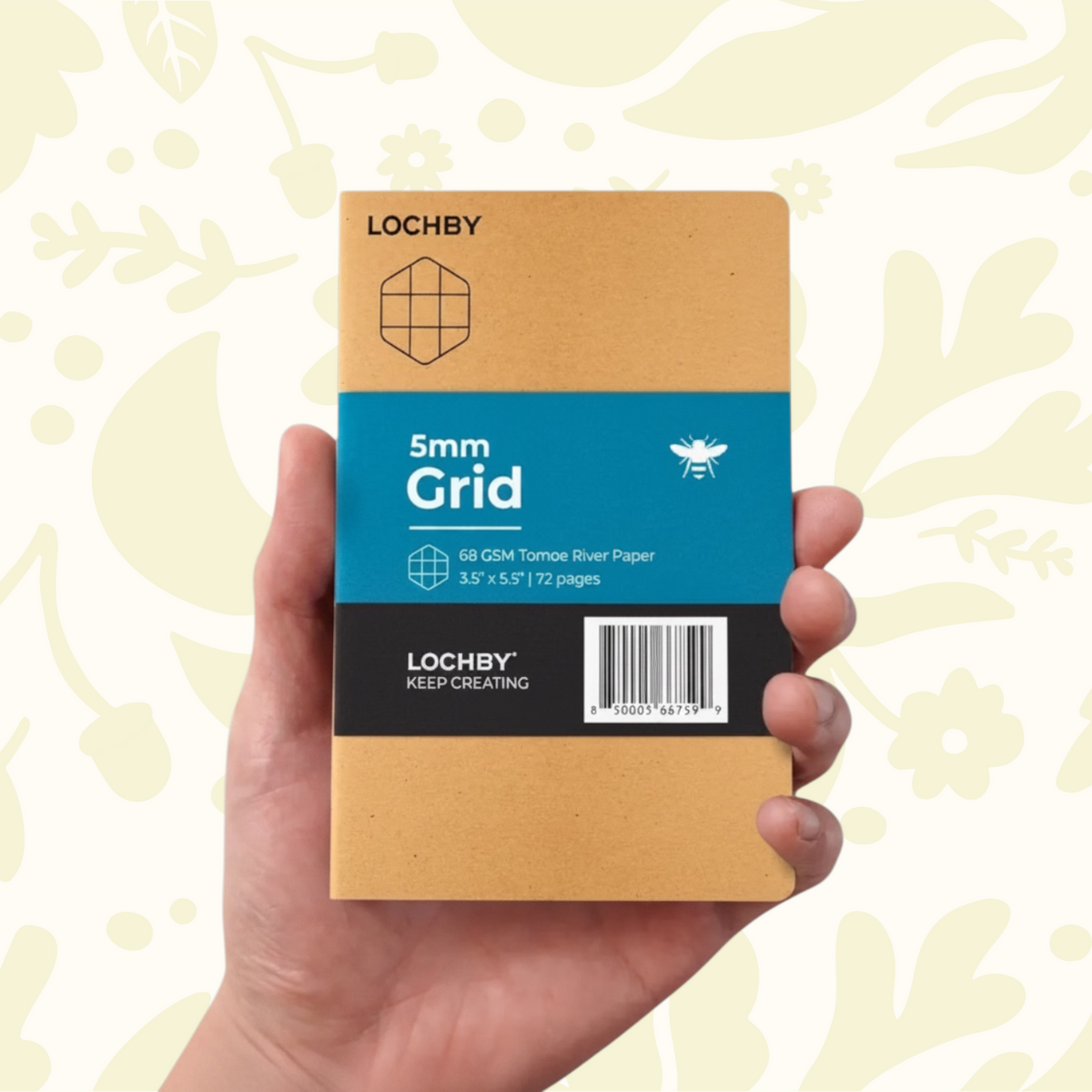 Forager Provisions LTD Lochby pocket notebook with tan cover and blue grid label held in a hand