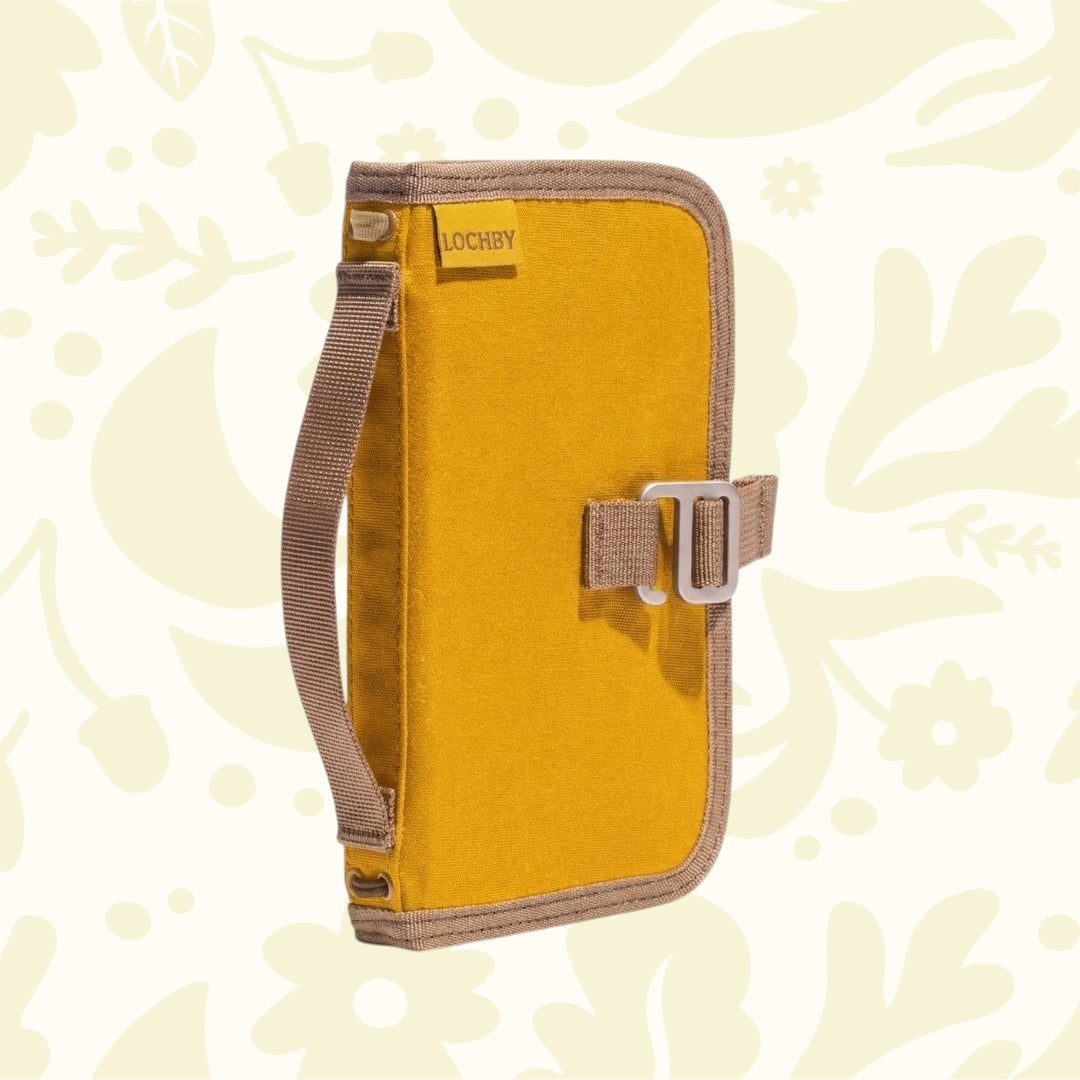 Forager Provisions LTD Lochby Mini Field Journal in mustard waxed canvas with a side handle and elastic closure.