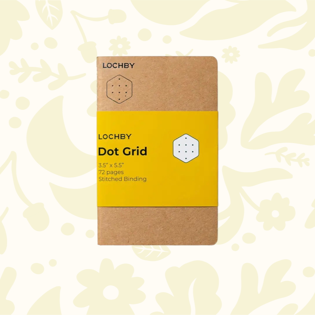 Forager Provisions LTD Lochby pocket notebook with brown cover and yellow dot grid belly band on floral background